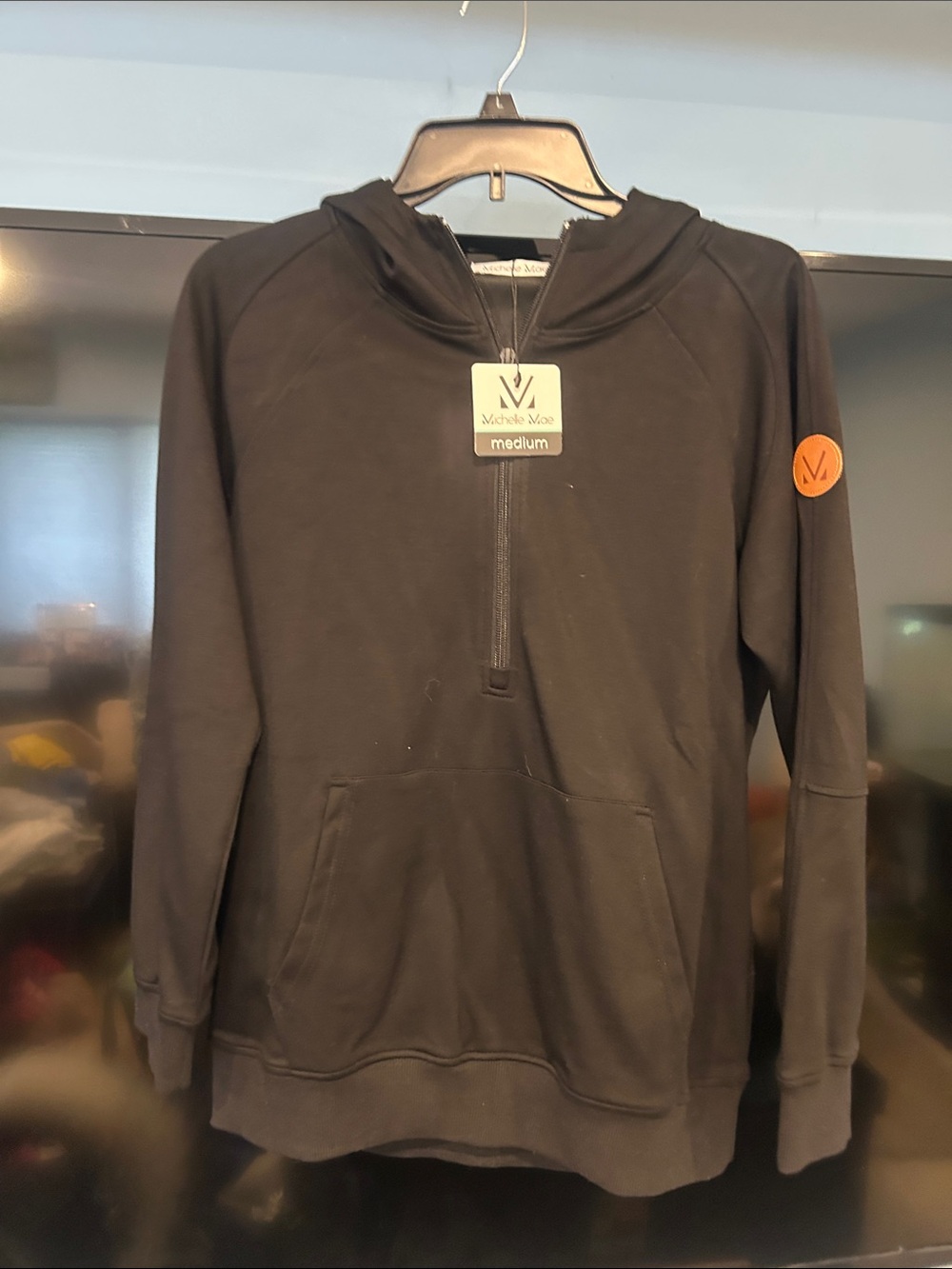 Michelle Mae Black Half-Zip Pullover Hoodie with Orange Patch